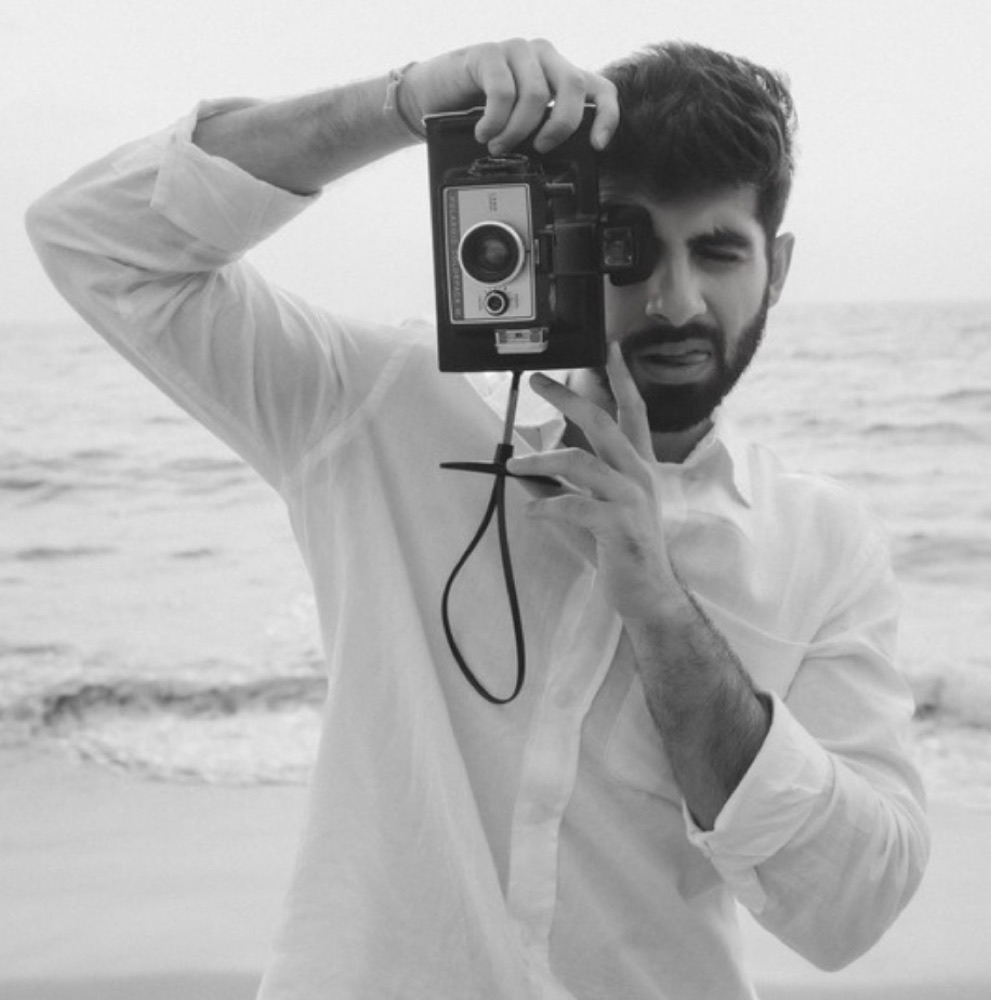 Rahul Dhiman holding a vintage camera